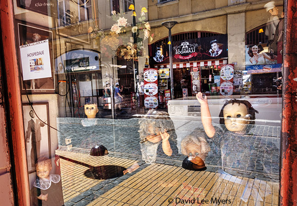 Shop window reflections, dolls, Valparaiso, Chile.