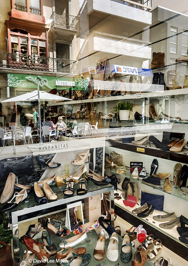 Shop window reflections, shoe store, Cuenca, Spain.